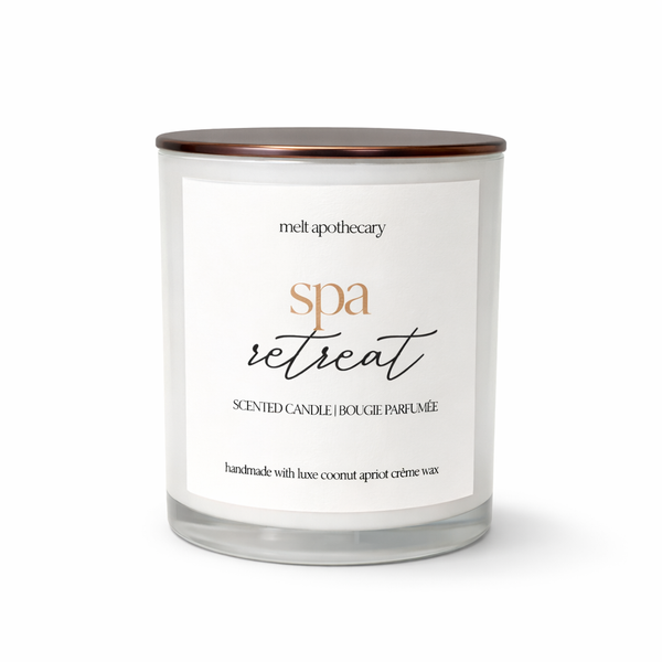 Scented candle labeled 'spa retreat' by Melt Apothecary on a white background
