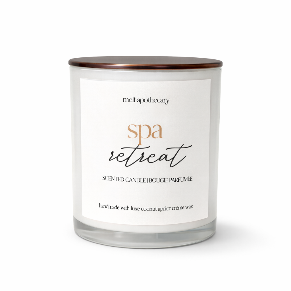 Scented candle labeled 'spa retreat' by Melt Apothecary on a white background
