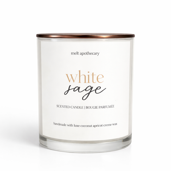 White sage scented candle with a white label on a white background