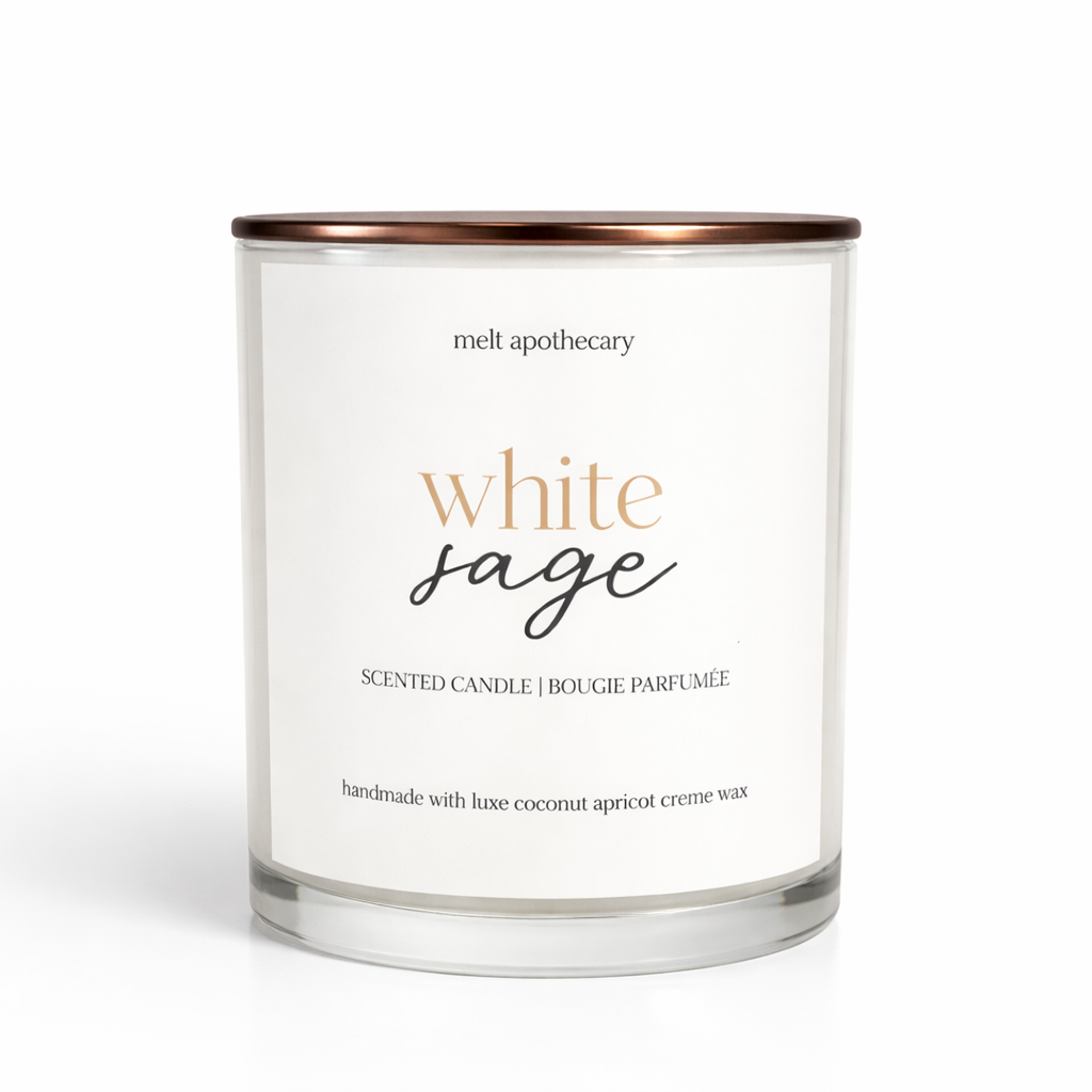 White sage scented candle with a white label on a white background