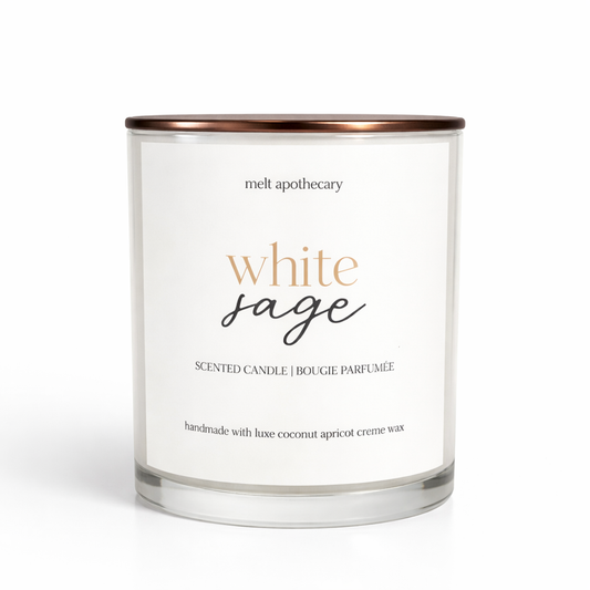 White sage scented candle with a white label on a white background